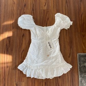 White eyelet Indikah mini dress with puff sleeves, new with tags but read more